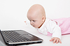 Infant with computer | Stock Foto