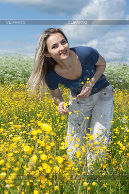 Beautiful girl in field with yellow flower | High resolution stock photo |ID 3307287
