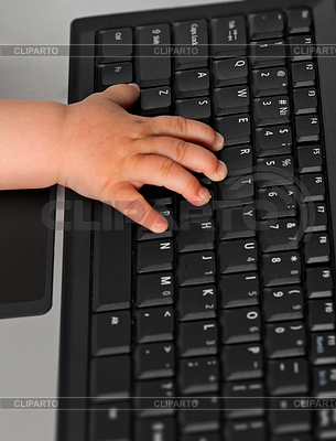 Kid hand on laptop keyboard | High resolution stock photo |ID 3376667